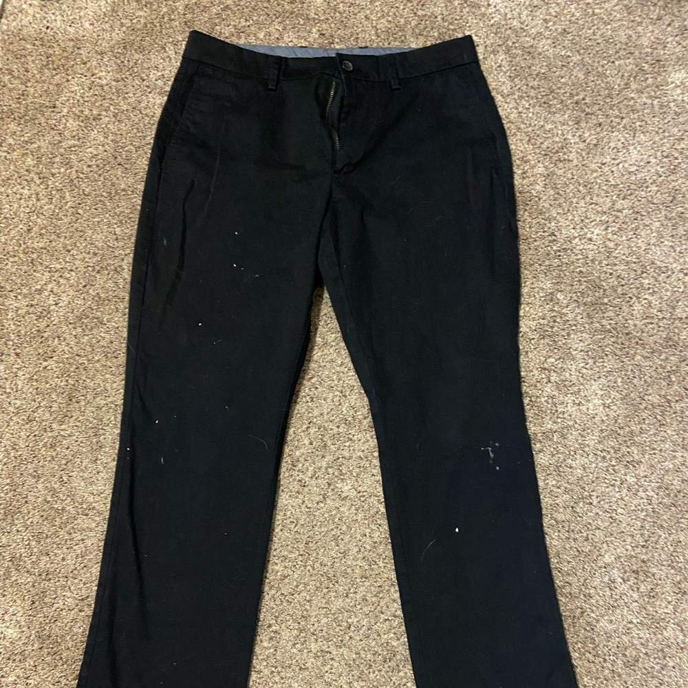 Black Old Navy pants with stain shown in photos